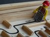 Berufseinstieg: Ein Lego-Männchen steht am Start in einem Labyrint.