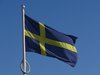 Die schwedische Fahne weht im Wind.