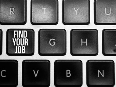 Jobsuche: Tastatur mit der Aufschrift "Find your job" auf einer Taste.